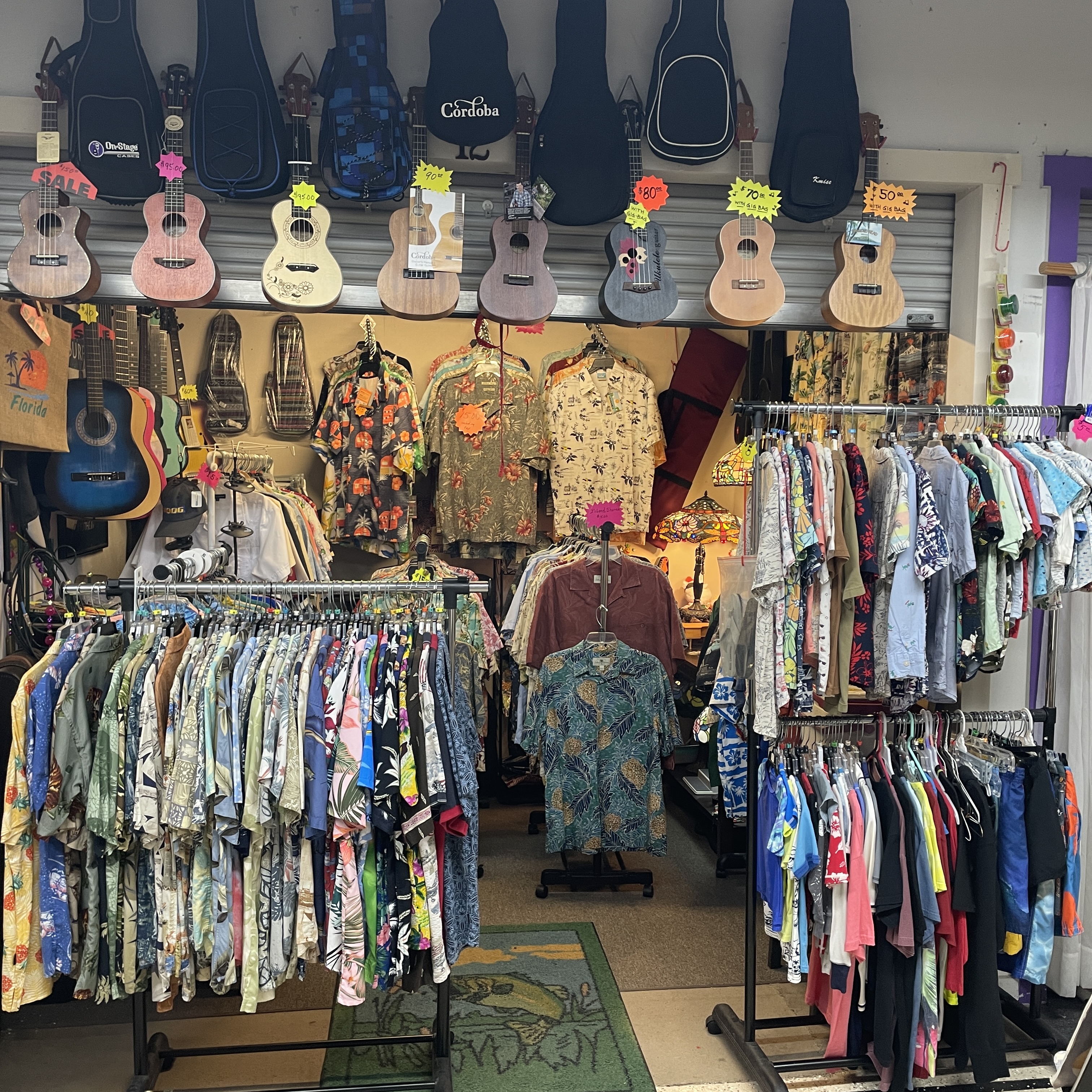 Hawaiian shirts and aloha shirts hanging in Guitar Stan's Daytona Beach shop at the Corner Shops Mall.